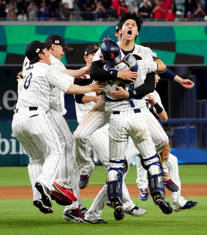 MIAMI, FL - MARCH 21: Shohei Ohtani #16 of Team Japan celebrates with teammates on the field after Team Japan defeated Team USA in the 2023 World Baseball Classic Championship game at loanDepot Park on Tuesday, March 21, 2023 in Miami, Florida. (Photo by Rob Tringali/WBCI/MLB Photos via Getty Images)